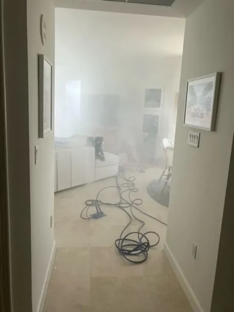 Hallway and room filling with treatment vapor during a whole-home job