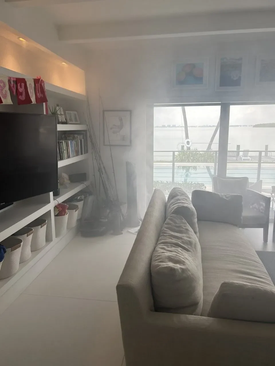Living room filling with treatment vapor beside the windows
